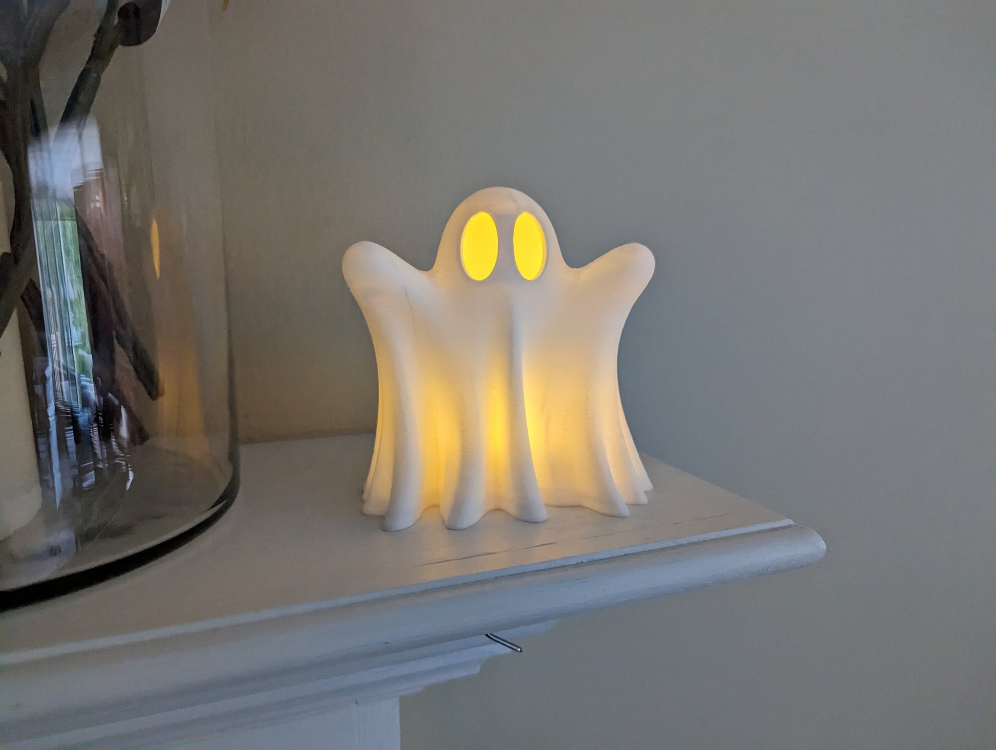 cute ghost with LED tea light on mantel