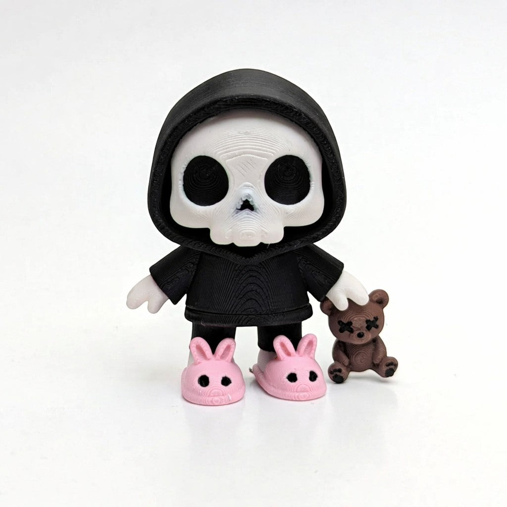 RedFive Labs Dead Tired articulated skeleton figurine wearing a black hoodie and pink bunny slippers with a teddy bear